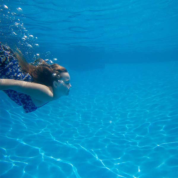 Girl Swimming Underwater will make a perfect background for any fresh or salt water tank or aquarium as well as dry terrariums.