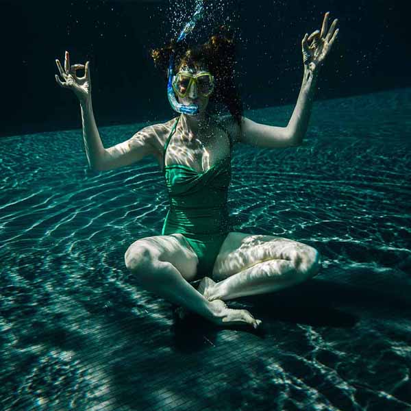 Woman Sitting Underwater will make a perfect background for any fresh or salt water tank or aquarium as well as dry terrariums.